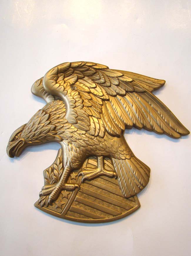 A cast plaster American eagle plaque by Miller Studios 1969